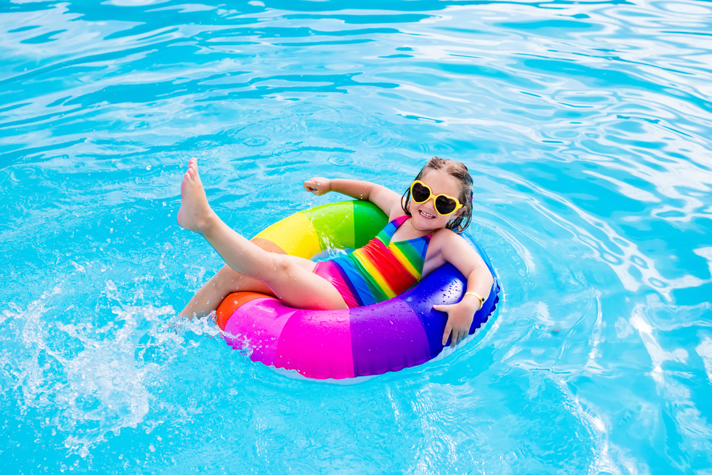 child floating in inflatable ring