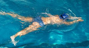 person exercising in pool