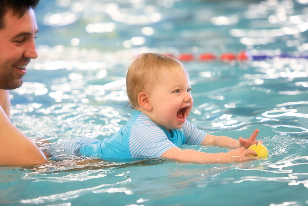 baby learning swim lessons