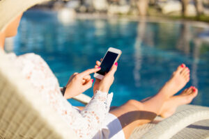 woman automating her pool temperature using her cell phone