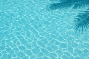 Clear turquoise pool water in Florida summer sunlight, symbolizing well-maintained pools after expert pool repair Florida summer services to prevent leaks, cracks, and equipment issues.