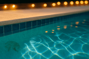 holiday pool service Orlando shown by a crystal-clear waterline with bistro-light reflections and bright sun caustics.